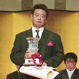 ミツ・ヒライの代理・息子の平井伸和